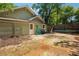 Backyard featuring an outdoor patio area and a green house at 642 Erin Sw Ave, Atlanta, GA 30310