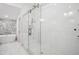 Modern bathroom featuring glass enclosed shower with dual showerheads and tiled walls at 642 Erin Sw Ave, Atlanta, GA 30310