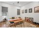 Bright bedroom featuring hardwood floors, a patterned rug, and posters on the wall at 642 Erin Sw Ave, Atlanta, GA 30310