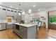 Modern kitchen featuring stainless steel appliances, gray cabinets, and a large central island at 642 Erin Sw Ave, Atlanta, GA 30310