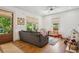 Bright living room with hardwood floors, large windows, and comfortable seating arrangement at 642 Erin Sw Ave, Atlanta, GA 30310