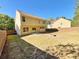 Spacious backyard featuring a well-maintained lawn, wooden fence, and patio area, perfect for outdoor activities and relaxation at 125 Redsage Rdg, Atlanta, GA 30349