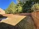 Large, fenced backyard showcasing a well-kept lawn, ideal for outdoor gatherings and providing privacy at 125 Redsage Rdg, Atlanta, GA 30349