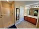 Bright bathroom with a shower, double vanity and a separate soaking tub at 125 Redsage Rdg, Atlanta, GA 30349