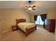A serene bedroom featuring a ceiling fan and neutral color scheme at 125 Redsage Rdg, Atlanta, GA 30349