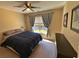 Cozy bedroom featuring a ceiling fan, natural light, and soothing neutral tones at 125 Redsage Rdg, Atlanta, GA 30349