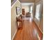 Inviting hallway with hardwood floors and a view of the living area at 125 Redsage Rdg, Atlanta, GA 30349