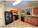 Efficient kitchen featuring black appliances, wood cabinets, and an open layout, convenient for meal preparation at 125 Redsage Rdg, Atlanta, GA 30349