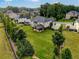Aerial shot of a home with a large backyard and covered patio in a residential neighborhood at 1835 Henley Way, Alpharetta, GA 30009