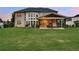 Expansive backyard with a covered patio and an outdoor seating area to enjoy a scenic view at 1835 Henley Way, Alpharetta, GA 30009