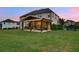 Expansive backyard features a covered patio perfect for outdoor living and entertaining at 1835 Henley Way, Alpharetta, GA 30009