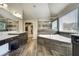 Luxurious bathroom with dual sinks, soaking tub, glass shower, and stylish tile flooring at 1835 Henley Way, Alpharetta, GA 30009