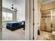 View of a bedroom and adjoining bathroom with modern tile at 1835 Henley Way, Alpharetta, GA 30009