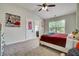Bedroom with ensuite bath, ceiling fan and large window overlooking the back yard at 1835 Henley Way, Alpharetta, GA 30009