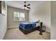 Cozy bedroom with neutral carpeting, natural light, and a ceiling fan at 1835 Henley Way, Alpharetta, GA 30009