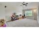 Spacious bonus room with a large window, ceiling fan, and neutral carpeting at 1835 Henley Way, Alpharetta, GA 30009