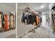 Spacious walk-in closet with built-in shelving and rods for organized clothing storage at 1835 Henley Way, Alpharetta, GA 30009