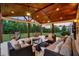 Relaxing covered patio with comfortable seating, ceiling fans, and stylish decor at 1835 Henley Way, Alpharetta, GA 30009