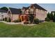 Beautiful two-story home with stone and brick exterior, a front yard, and well-placed landscaping at 1835 Henley Way, Alpharetta, GA 30009