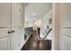 Hallway with hardwood floors, iron railings, and a staircase at 1835 Henley Way, Alpharetta, GA 30009