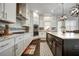 Stylish kitchen featuring custom cabinets, granite countertops, and a modern island at 1835 Henley Way, Alpharetta, GA 30009