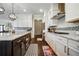 Beautiful kitchen with an island, a gas stove, and granite countertops at 1835 Henley Way, Alpharetta, GA 30009