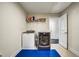 Bright laundry room with modern appliances and storage space, with door leading outside at 1835 Henley Way, Alpharetta, GA 30009