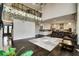 Spacious living room with a two-story foyer, hardwood floors, and modern kitchen at 1835 Henley Way, Alpharetta, GA 30009