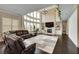 Spacious living area with soaring ceilings, fireplace, and large windows at 1835 Henley Way, Alpharetta, GA 30009