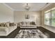 Cozy living room with neutral walls, dark floors, and a large window at 1835 Henley Way, Alpharetta, GA 30009