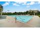 Community swimming pool featuring clear water, surrounding lounge chairs, and mature landscaping at 1835 Henley Way, Alpharetta, GA 30009