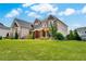Well-maintained home showcasing the side exterior, expansive lawn, and landscaped yard at 1835 Henley Way, Alpharetta, GA 30009