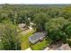 A cozy home with a deck and ample yard space surrounded by a lush green canopy of trees at 117 Franklin Rd, Woodstock, GA 30188