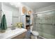 Beautiful bathroom featuring a walk-in shower, with decorative accents, and modern vanity at 117 Franklin Rd, Woodstock, GA 30188