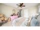 Comfortable bedroom with a plush teddy bear, pretty pink dresser and charming decor at 117 Franklin Rd, Woodstock, GA 30188