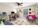 Cozy bedroom with unique decorations, a comfortable papasan chair and natural light at 117 Franklin Rd, Woodstock, GA 30188