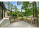 Spacious outdoor deck perfect for entertaining and enjoying the serene surroundings at 117 Franklin Rd, Woodstock, GA 30188