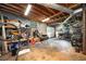 A cluttered garage provides storage and workspace at 117 Franklin Rd, Woodstock, GA 30188