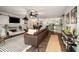 Open-concept living room with fireplace, stylish decor, and seamless flow to the kitchen at 117 Franklin Rd, Woodstock, GA 30188