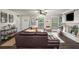 Inviting living space with comfortable furniture, a fireplace, and ample natural light at 117 Franklin Rd, Woodstock, GA 30188