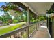 Charming front porch adorned with hanging flower baskets and view of the neighborhood at 117 Franklin Rd, Woodstock, GA 30188