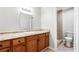 Bathroom features granite counters, cabinet, toilet and shower with tile surround at 3575 Oakvale Rd # 301, Decatur, GA 30034