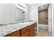 Bright bathroom featuring a granite countertop and a separate tiled shower and toilet area at 3575 Oakvale Rd # 301, Decatur, GA 30034