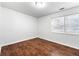 A bedroom features attractive hard wood floors and a bright window at 3575 Oakvale Rd # 301, Decatur, GA 30034