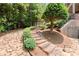 Stone steps lead through lush landscaping to the home's backyard at 4105 Cougar Ne Pt, Marietta, GA 30066