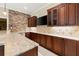 A bar area features granite countertops, custom cabinetry, and modern appliances at 4105 Cougar Ne Pt, Marietta, GA 30066