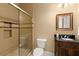 Bathroom with tiled shower and glass door, custom vanity, and modern fixtures, offering a luxurious feel at 4105 Cougar Ne Pt, Marietta, GA 30066