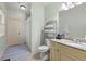Charming bathroom with a vanity, a granite countertop, and organized storage for a soothing experience at 4105 Cougar Ne Pt, Marietta, GA 30066