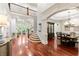 An elegant two-story foyer flows into the formal dining room and living spaces, featuring hardwood floors and soaring ceilings at 4105 Cougar Ne Pt, Marietta, GA 30066