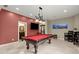 Game room with a pool table, large TV, and custom lighting, perfect for entertaining guests at 4105 Cougar Ne Pt, Marietta, GA 30066